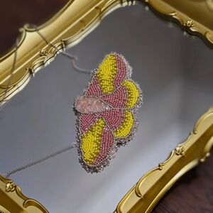 One of a kind beaded moth necklace. 12" silver stamped.